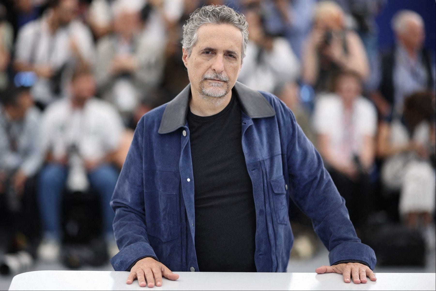 Brazilian Director Leber Mendonca Filho poses during a photocall for the film "O Agente Secreto" (The Secret Agent) at the 78th edition of the Cannes Film Festival in Cannes, southern , on May 19, 2025. (Photo by Valery HACHE / AFP)