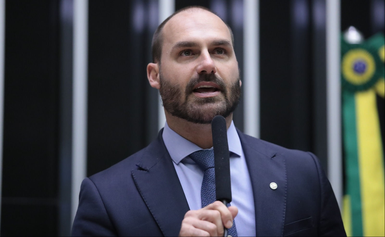 Licenciado do mandato de deputado federal, Eduardo Bolsonaro disse que ia para os EUA buscar 'justas punições' ao ministro Alexandre de Moraes, do STF
