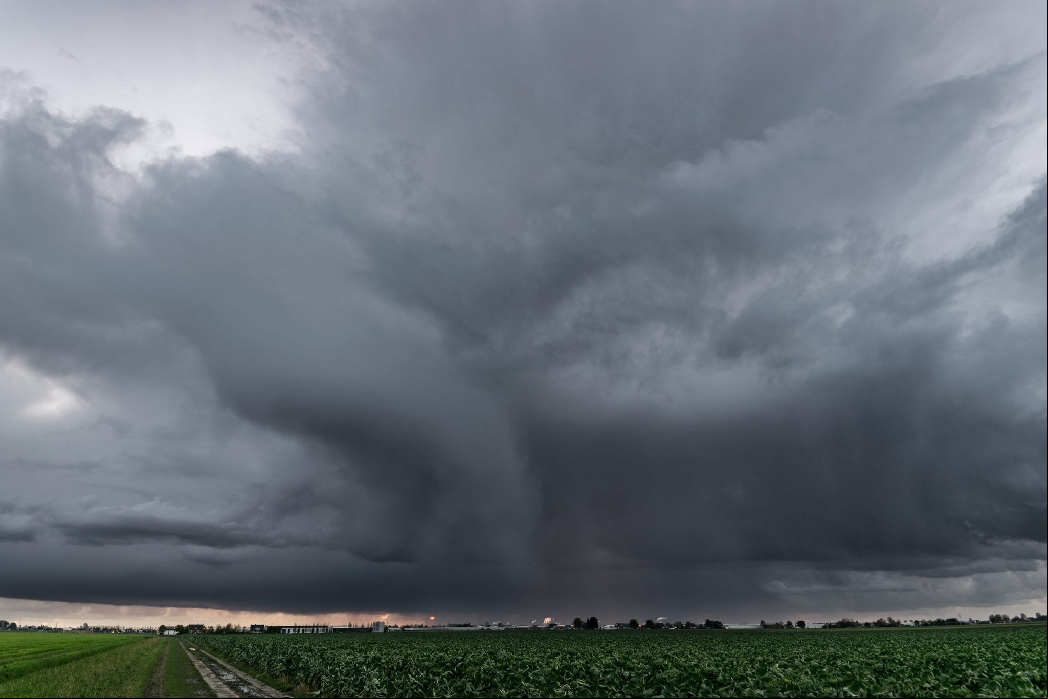 Beautiful storm structure with rain streaks clearly visible. Photographed close to the cities of Rotterdam and Gouda, Netherlands.