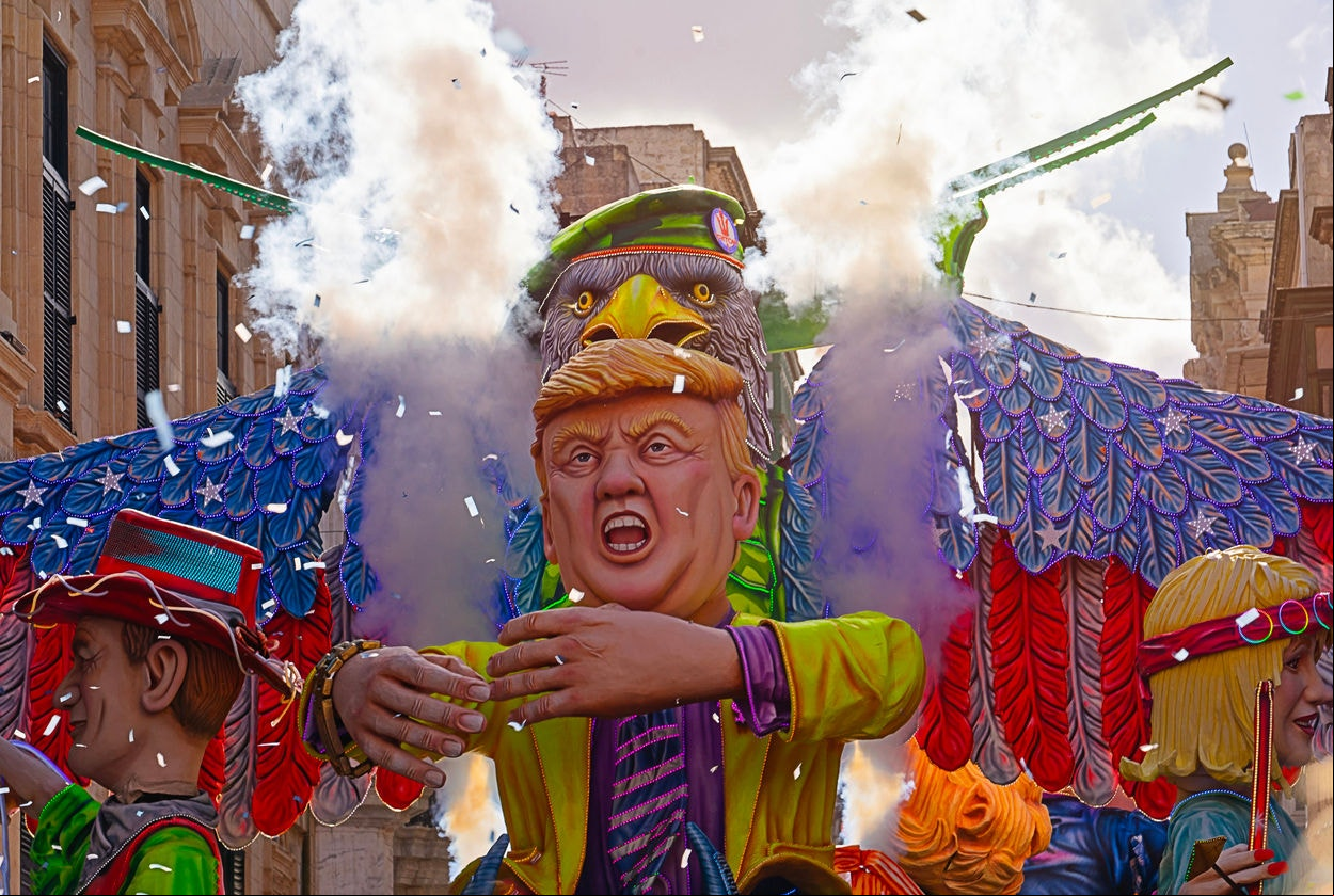 Mardi Gras Grand Parade featuring allegorical floats, including Donald Trump doll, during the carnival celebration on the streets of Valletta, Malta-February 23, 2020